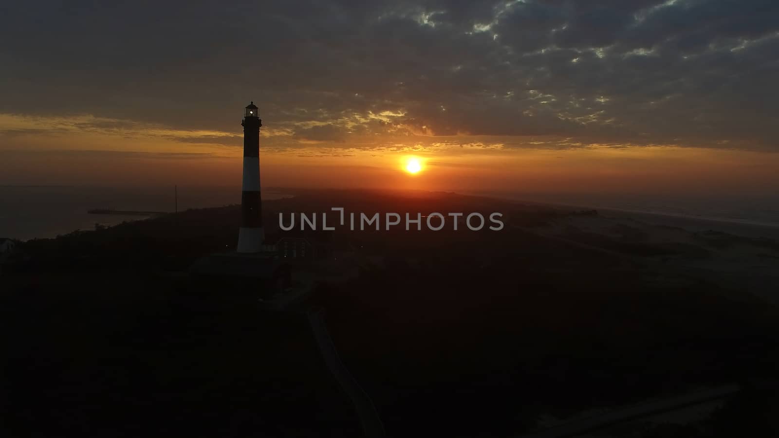 Aerial View of Sunrise at lighthouse on Long Island on a Spring Morning by a Drone