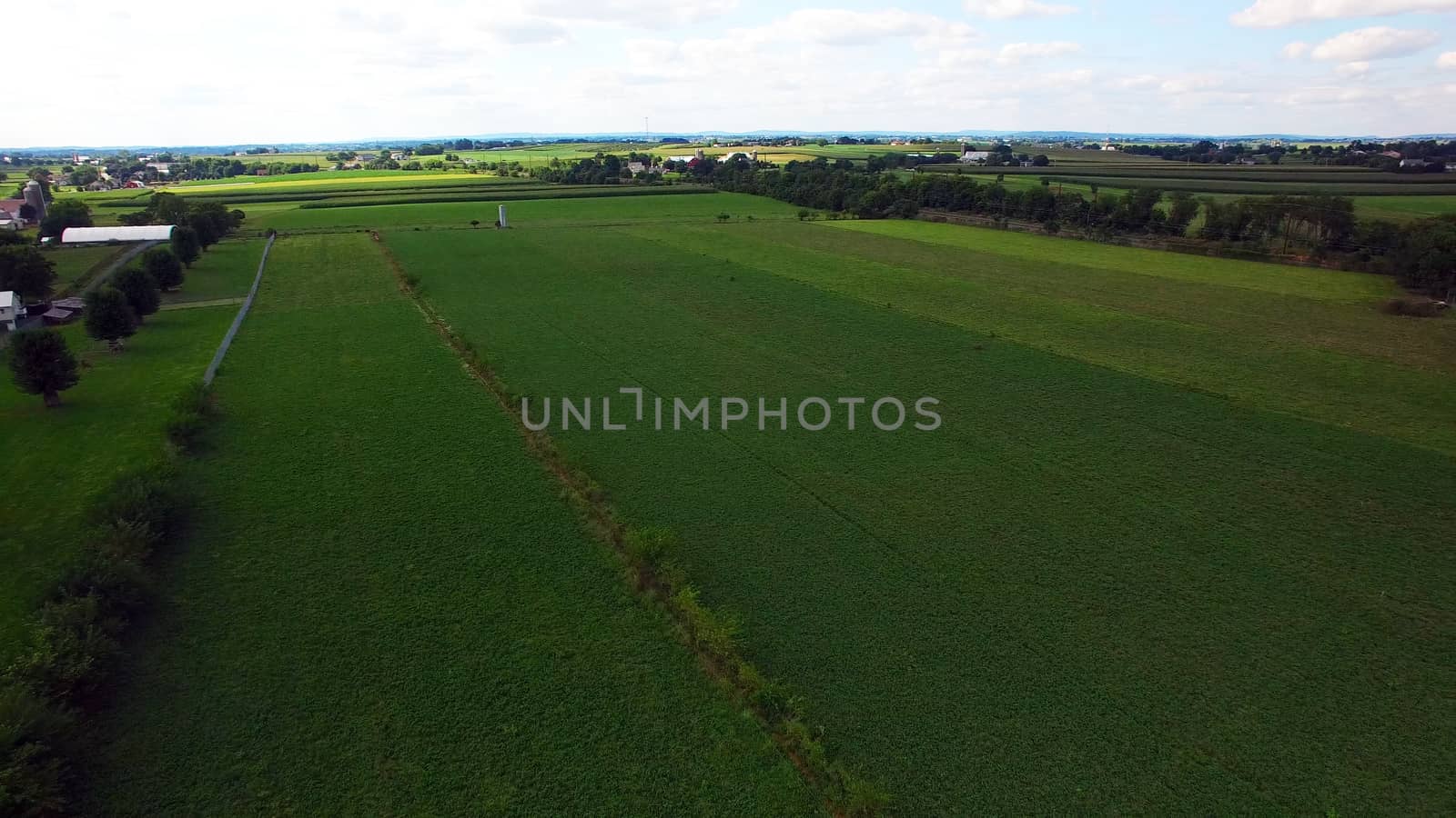 Aerial View of Amish Farm Countryside in Autumn from a Drone