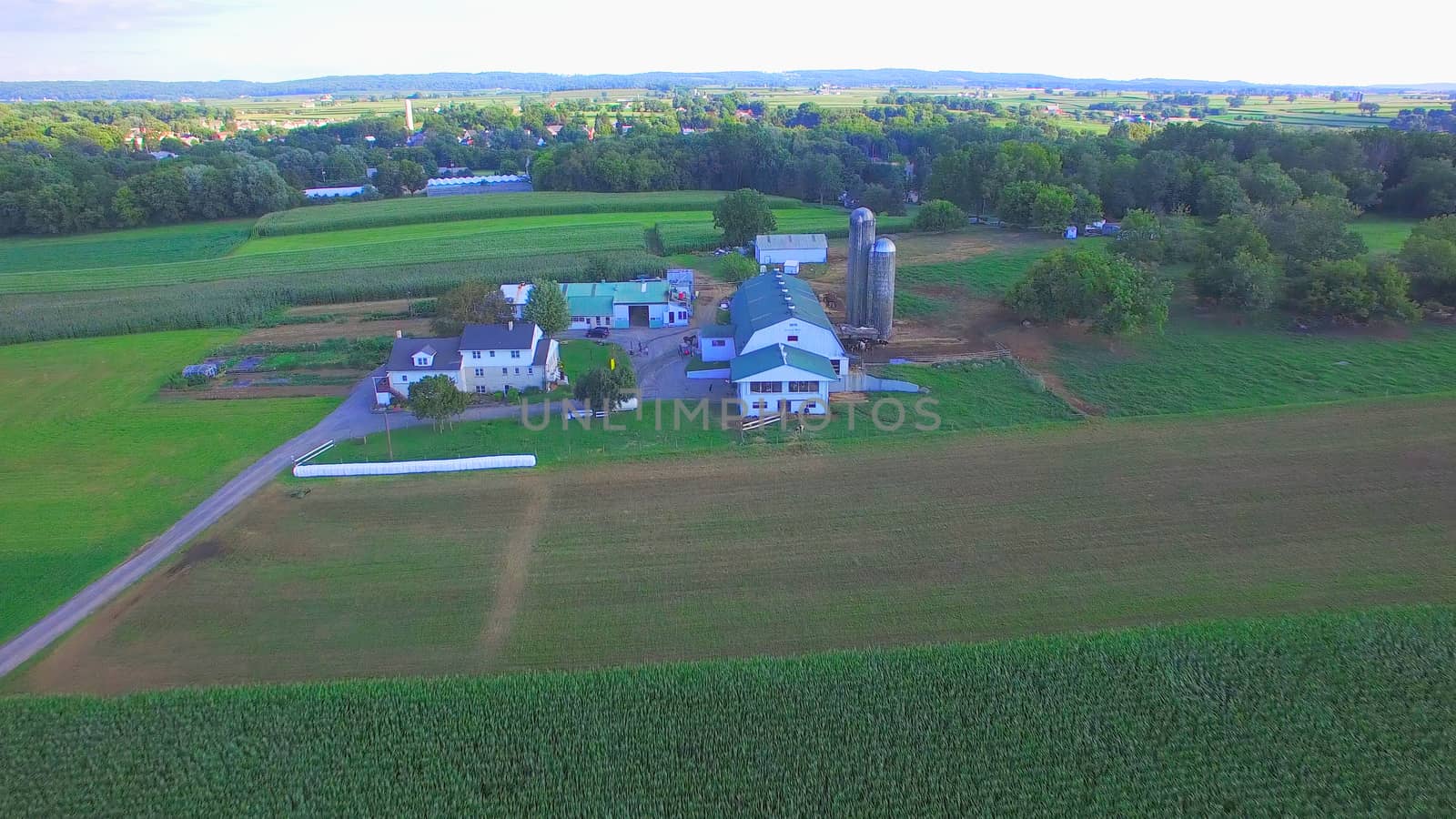 Aerial View of Amish Farm Countryside in Autumn from a Drone
