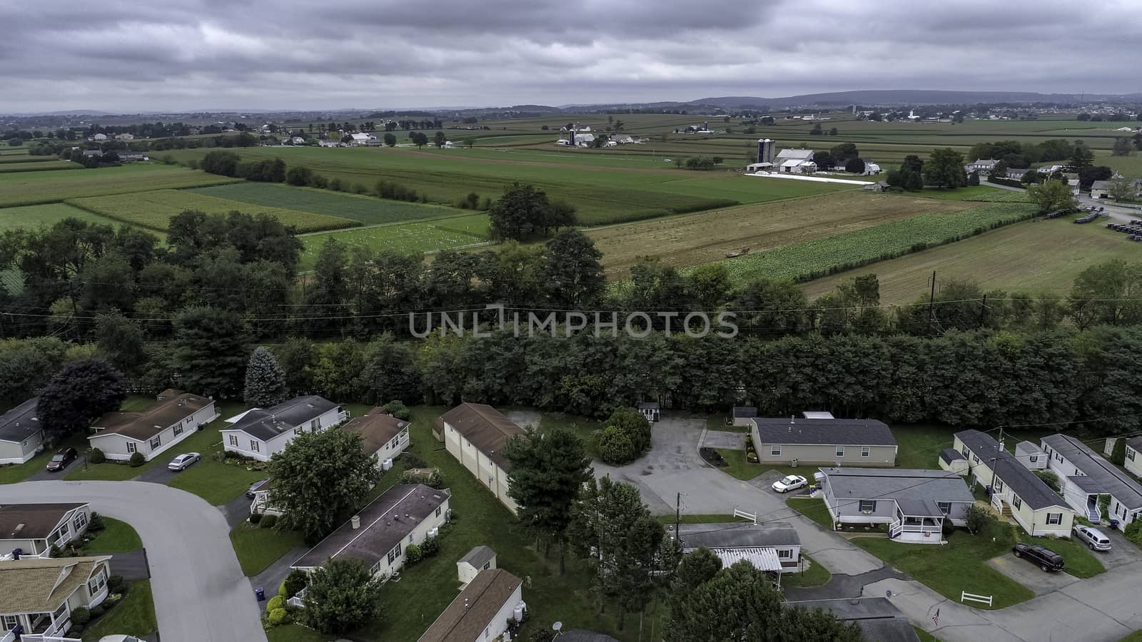 Aerial View of Amish Farm Countryside in Autumn from a Drone