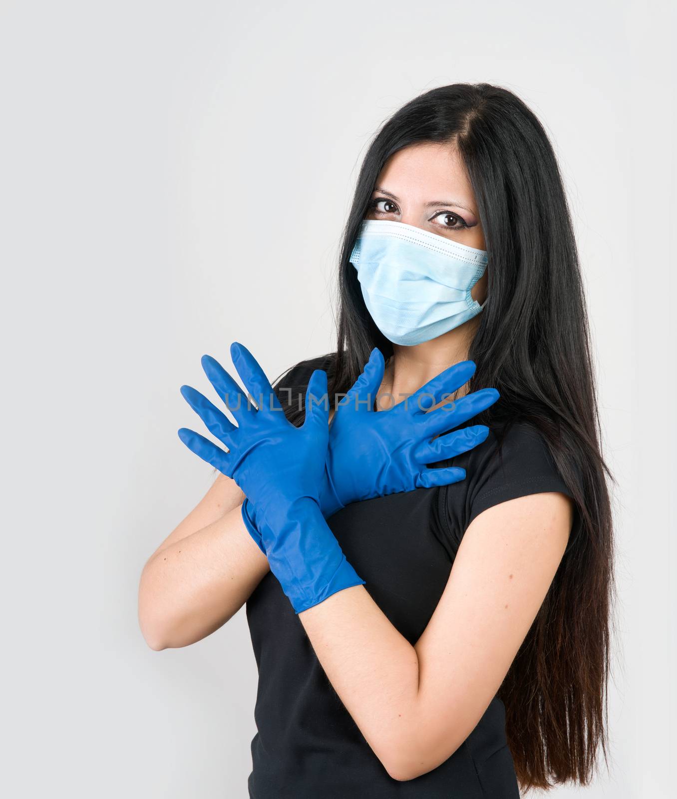 beautiful woman recommends what to wear for prevention, gloves and mask. isolated