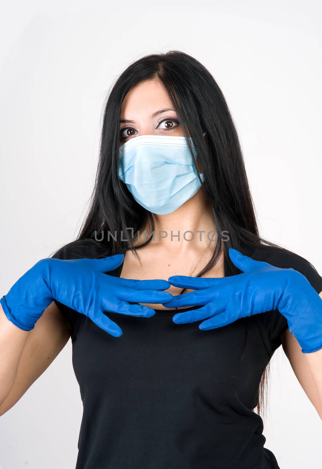 beautiful woman recommends what to wear for prevention, gloves and mask