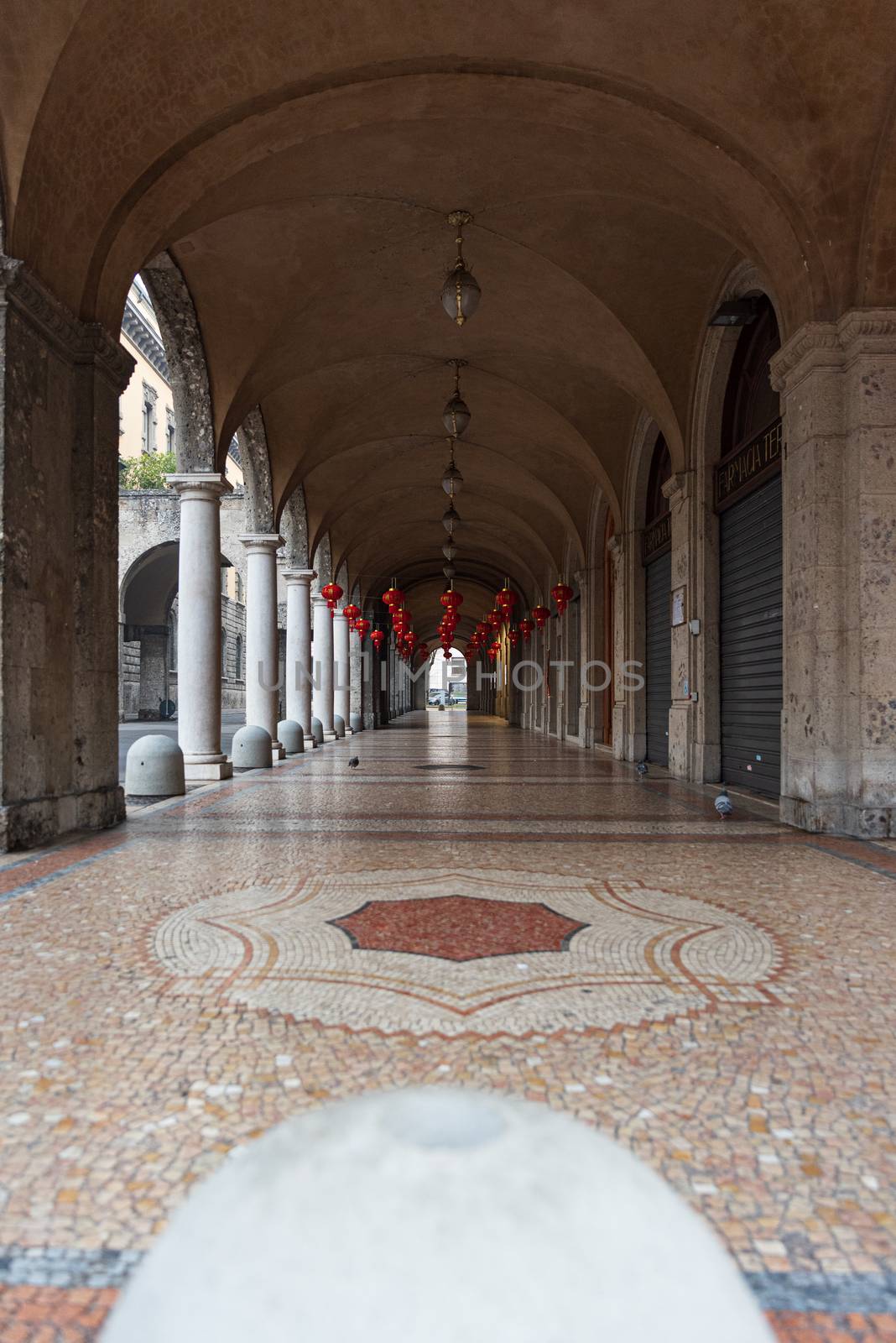 City arcades with red Chinese lanterns by brambillasimone