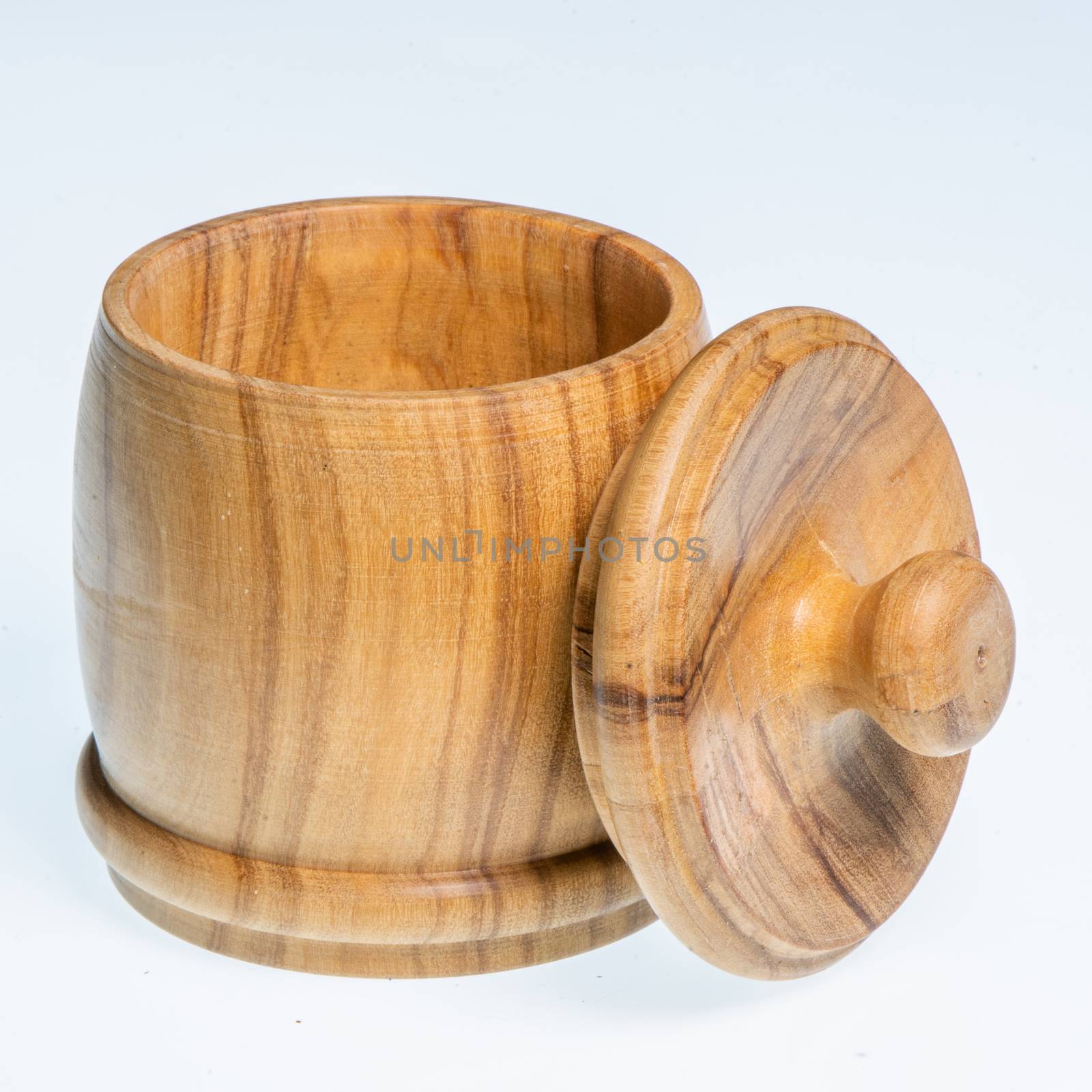 Small wooden barrel-shaped container with open lid, square image on white background