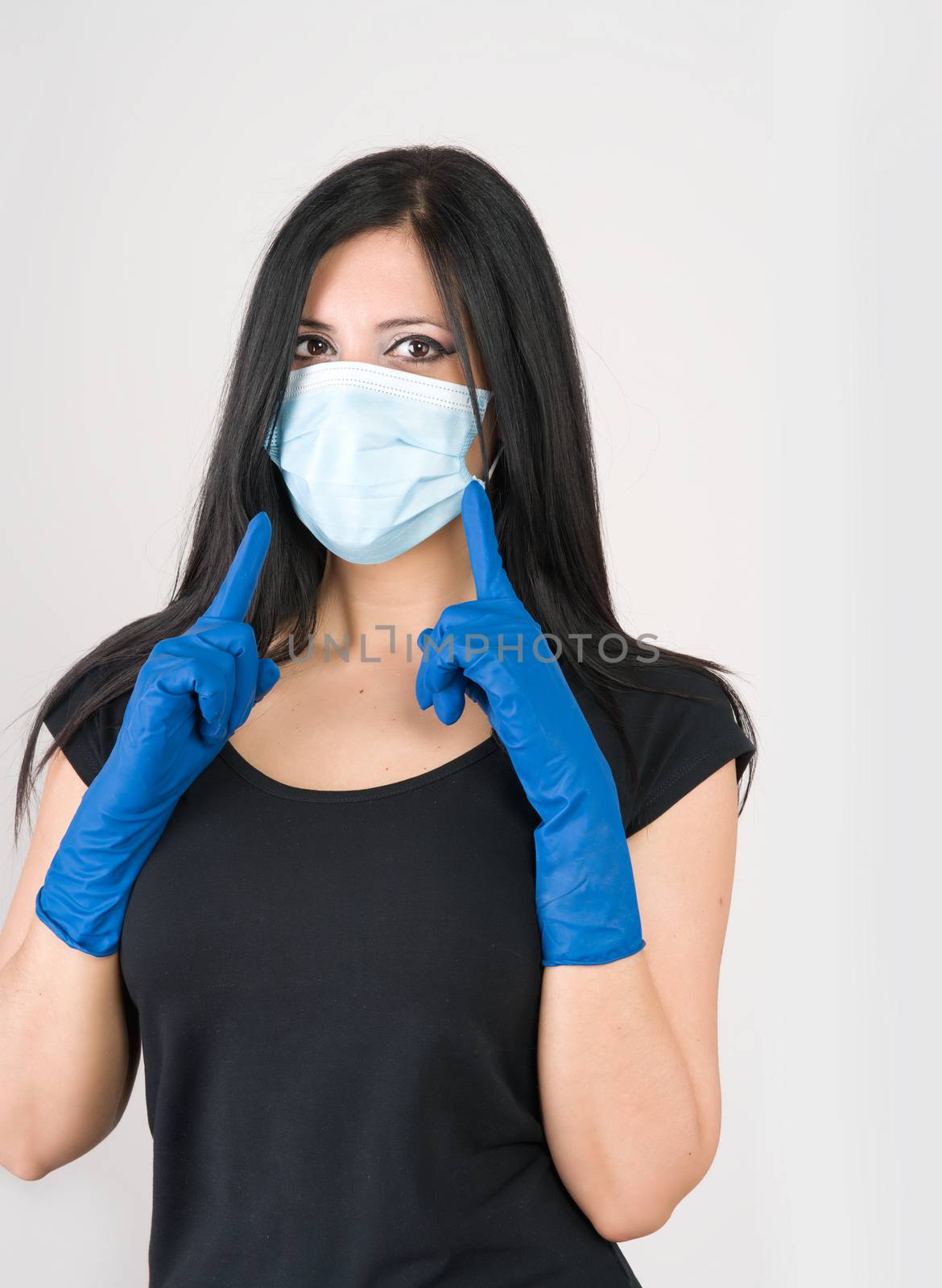 beautiful woman recommends what to wear for prevention, gloves and mask