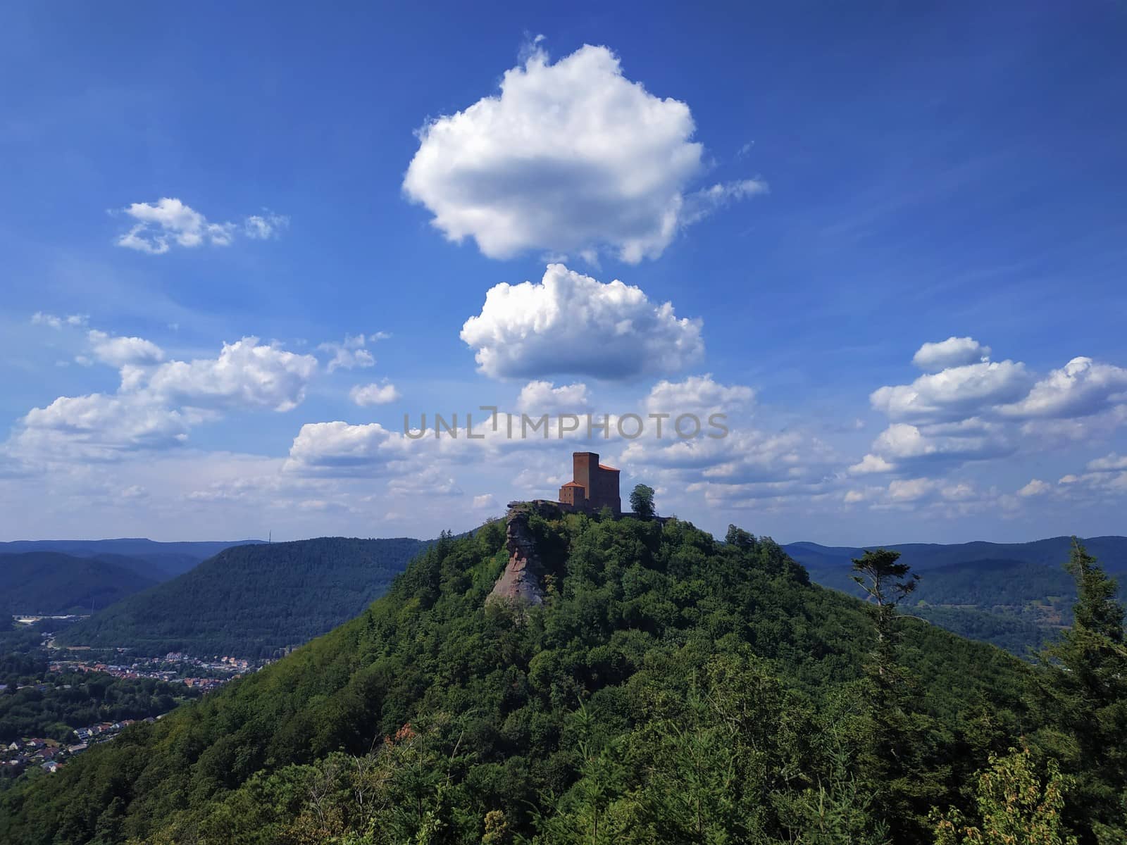 Interesting cloud formation over Trifels castle located on hill top by pisces2386