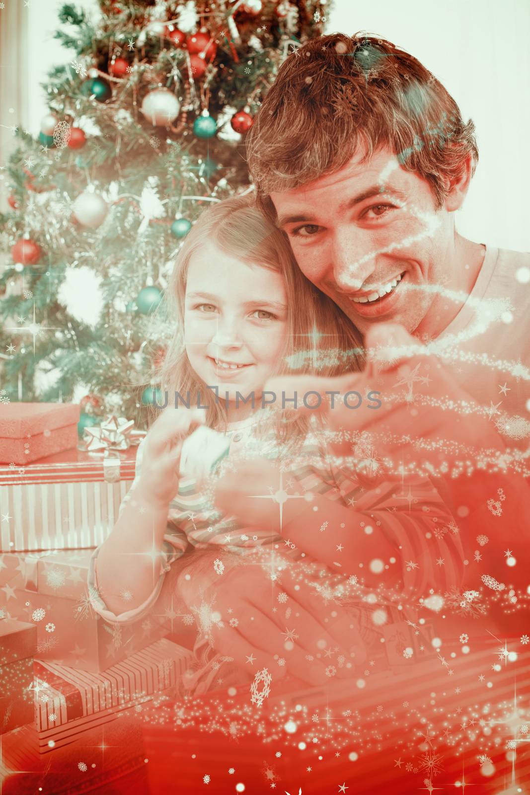 Father and little girl playing with Christmas presents against glittering christmas tree design