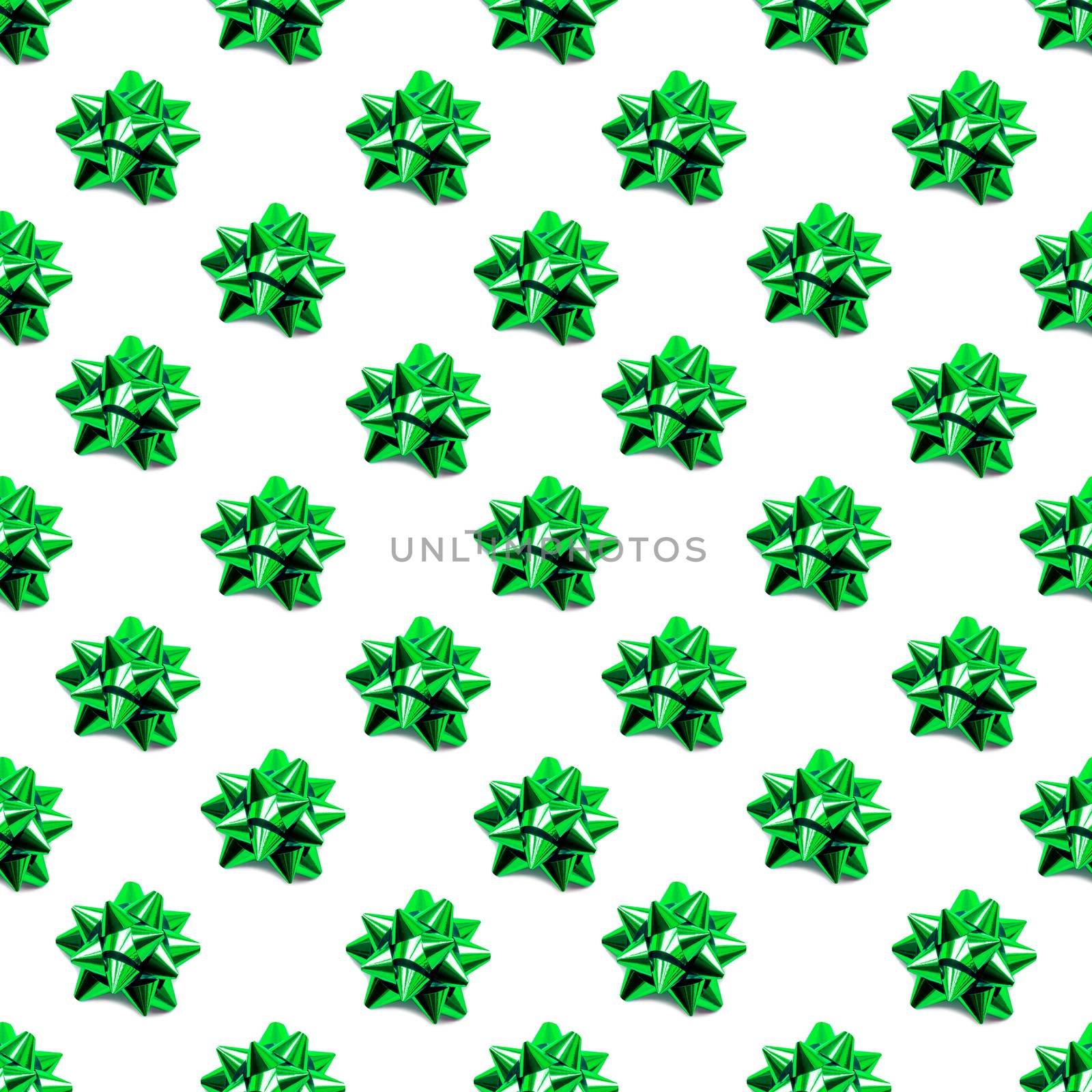 Seamless pattern with sparkling green bow. Holidaybackground with decorative bows.