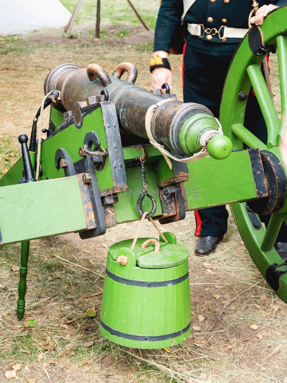 Ancient cannon, firing iron cores. Old weapon on historical festival Times and Epochs. Moscow, Russia.