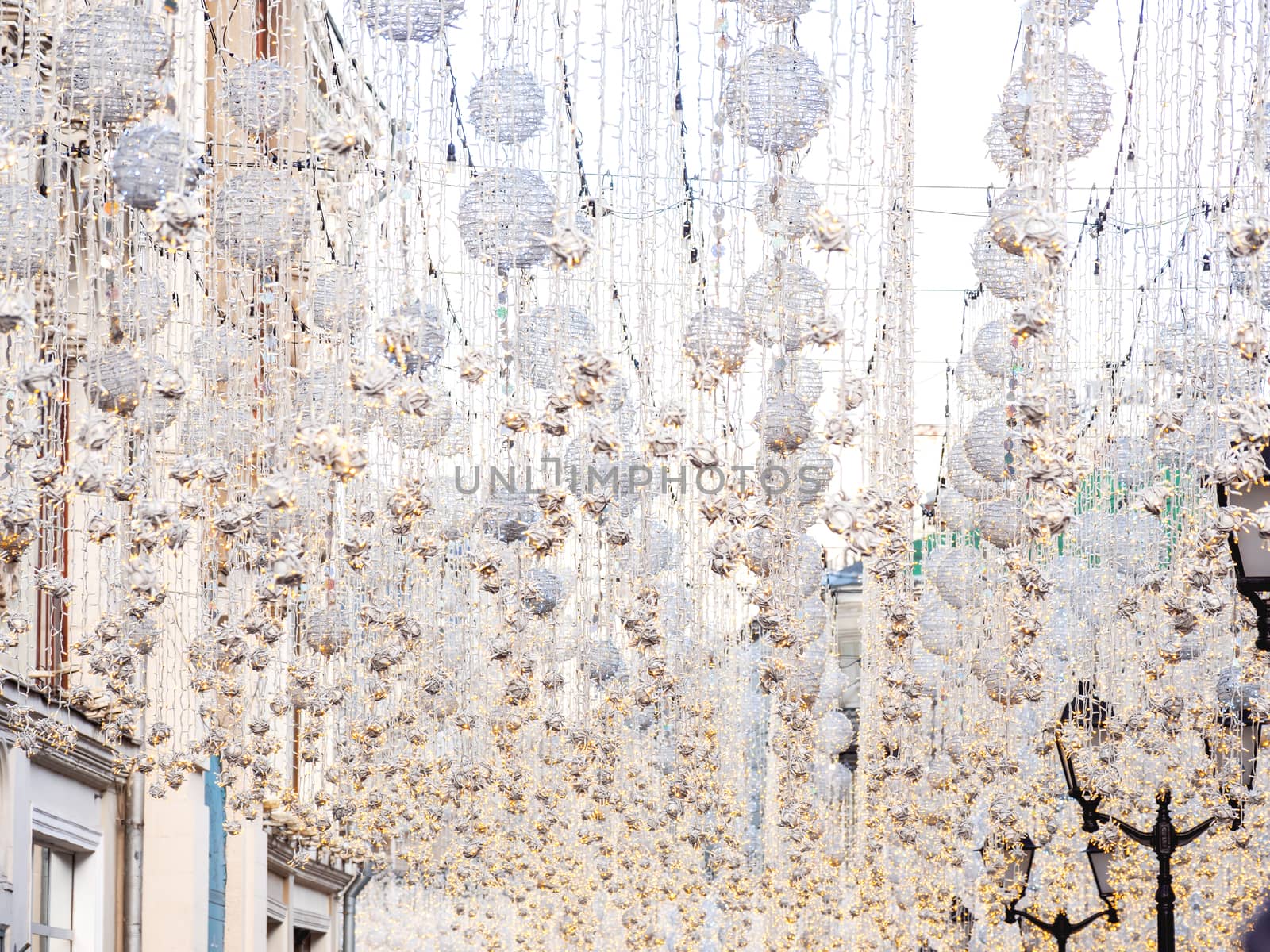 Famous Nikolskaya street decorated with light bulbs. Moscow, Russia.