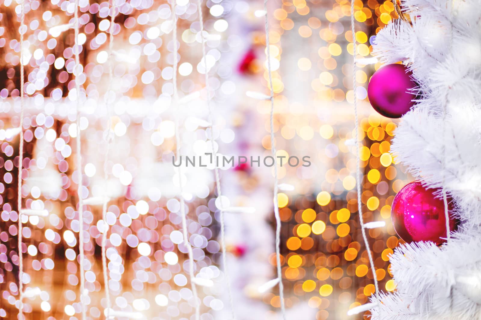 Christmas and New Year outdoors decorations - light bulbs and balls. Festive background.