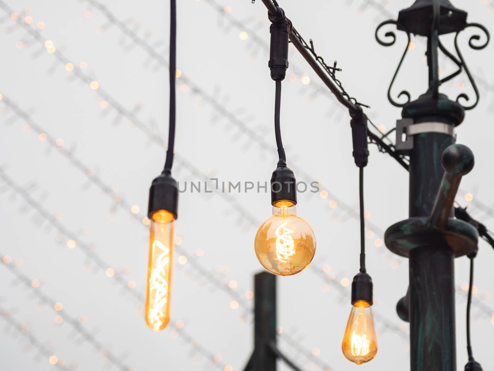 Vintage light bulbs with glower filament. Incandescent retro design. Outdoor decoration for New Year and Christmas celebration. Moscow, Russia.