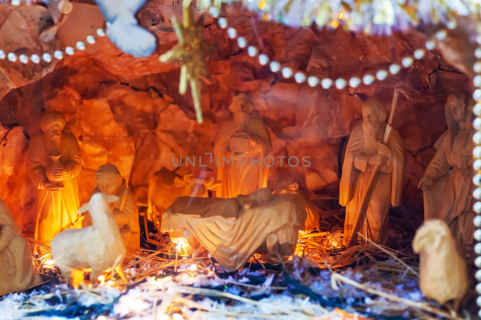 Christmas vertep, scene of birth of Jesus Christ toys. Holiday composition, religious scene with Virgin Mary, baby, Joseph and three wise men in store window.
