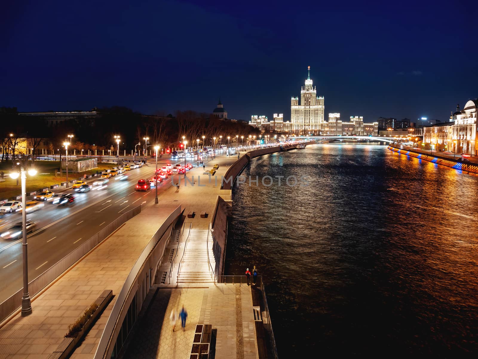 Night cityscape of Moscow-river and famous Stalin's skyscraper on Kotelnicheskaya embankment. Moscow, Russia.