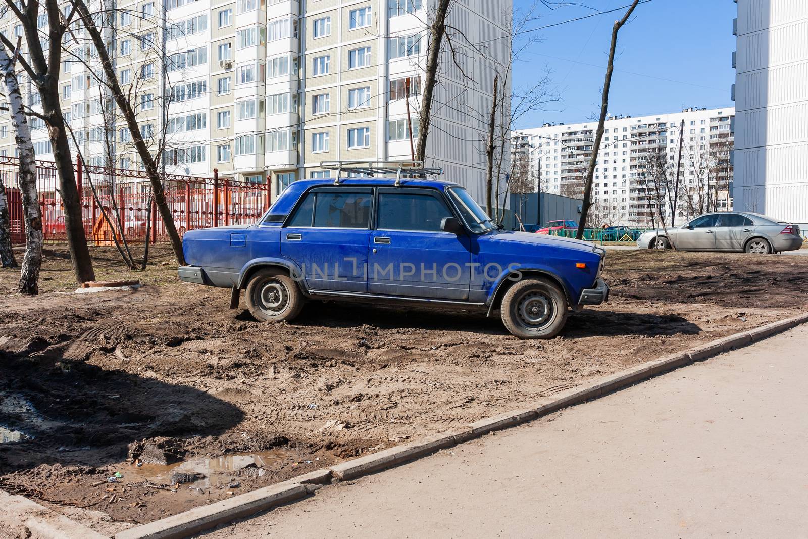 Drivers parked their cars on the lawn. People are breaking parking rules. Moscow, Russia.