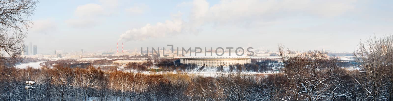 Panorama view on Luzhniki stadium and Sparrow Hills from observation deck near Moscow State Univercity (MSU). Winter sunny day. Moscow, Russia.