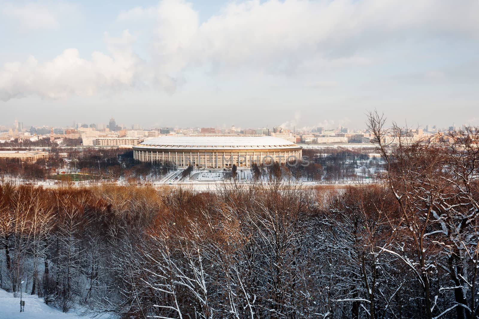 Panorama view on Luzhniki stadium and Sparrow Hills from observation deck near Moscow State Univercity (MSU). Winter sunny day. Moscow, Russia.