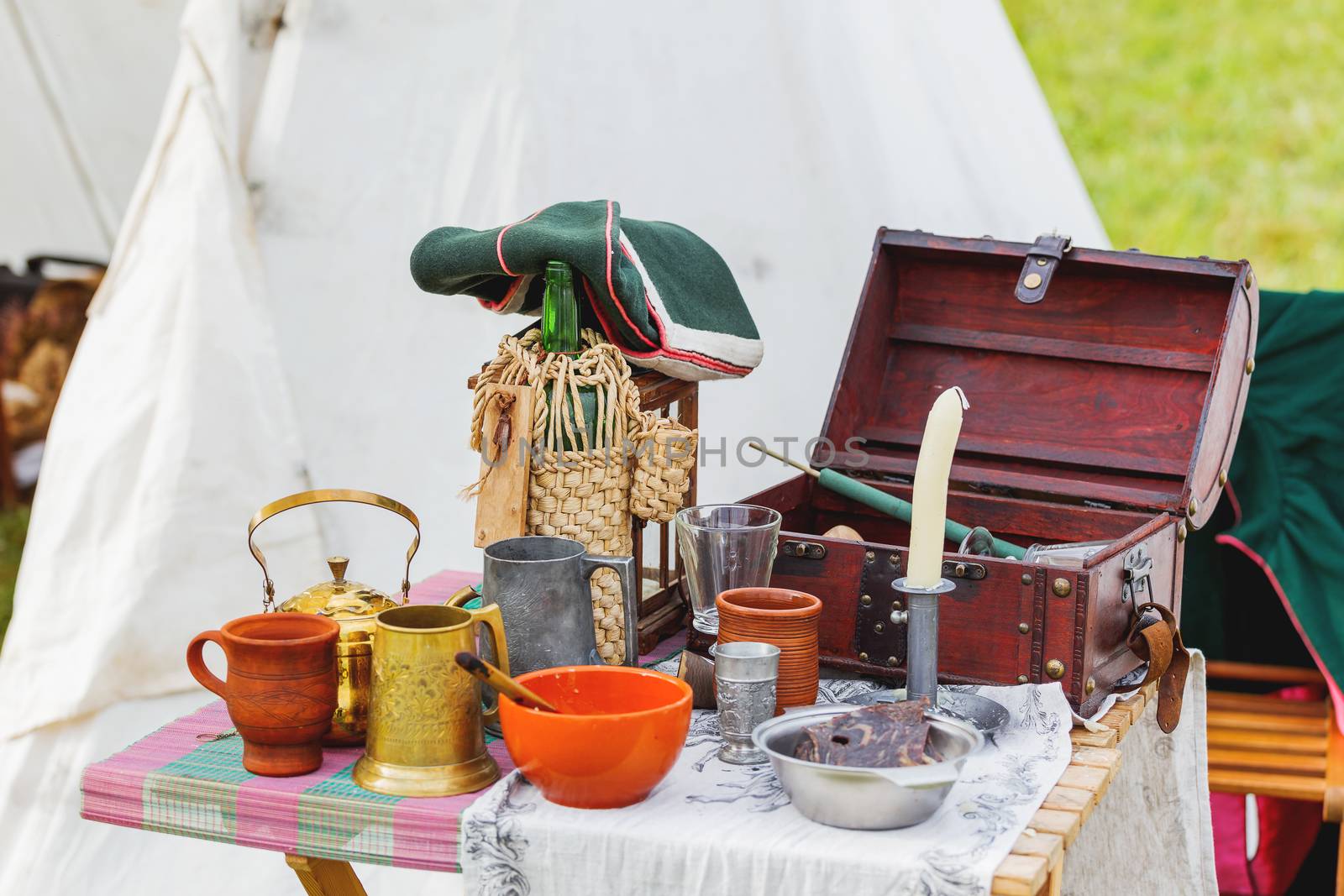 Old fashioned interior items, dishes and kitchen utensils. Historical reconstruction of 19 century.