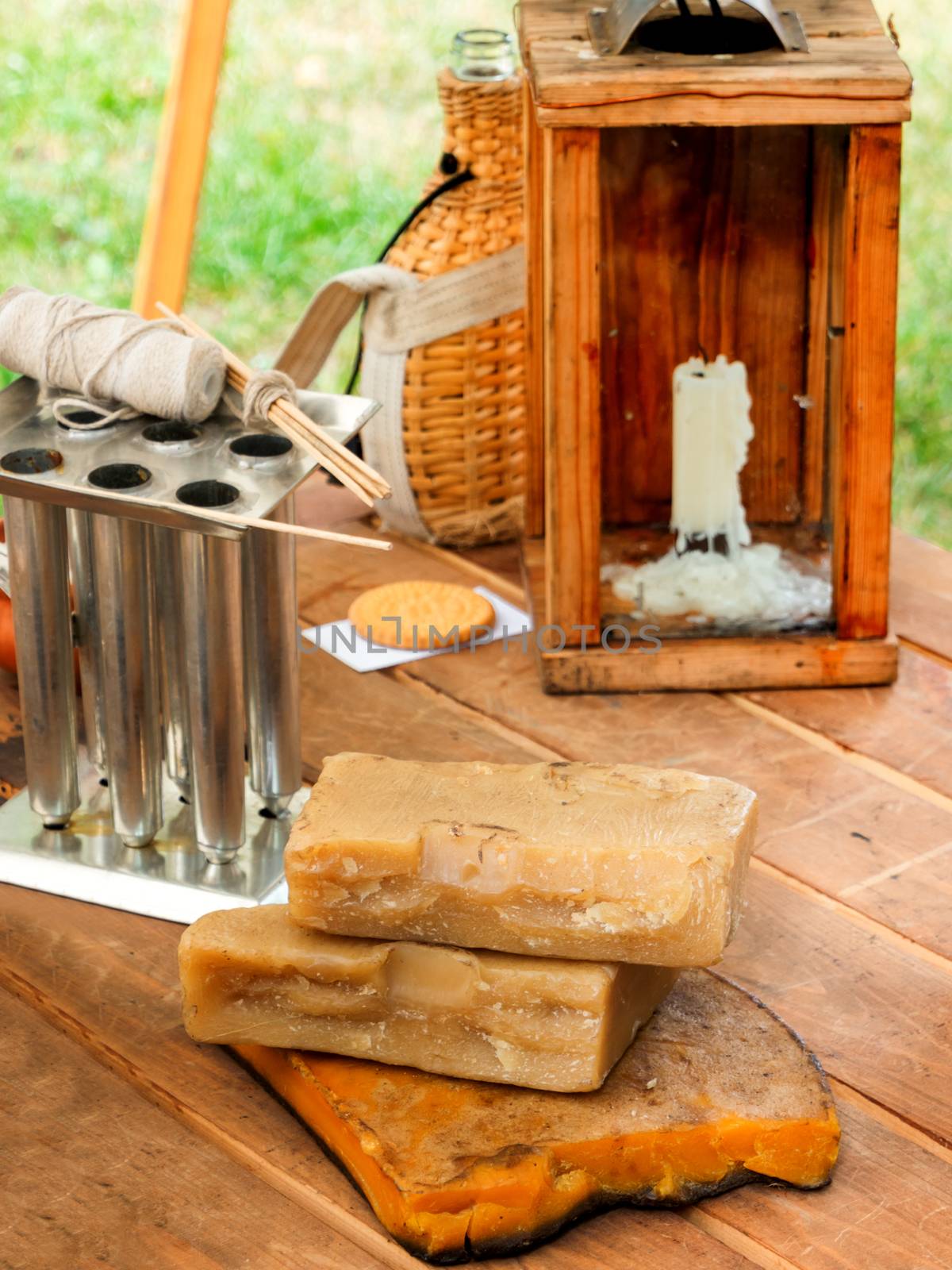 Old fashioned household items in markitant tent, set for candle and soap making. Historical reconstruction of 19th century. Festival Times and Epochs. Moscow, Russia. by aksenovko