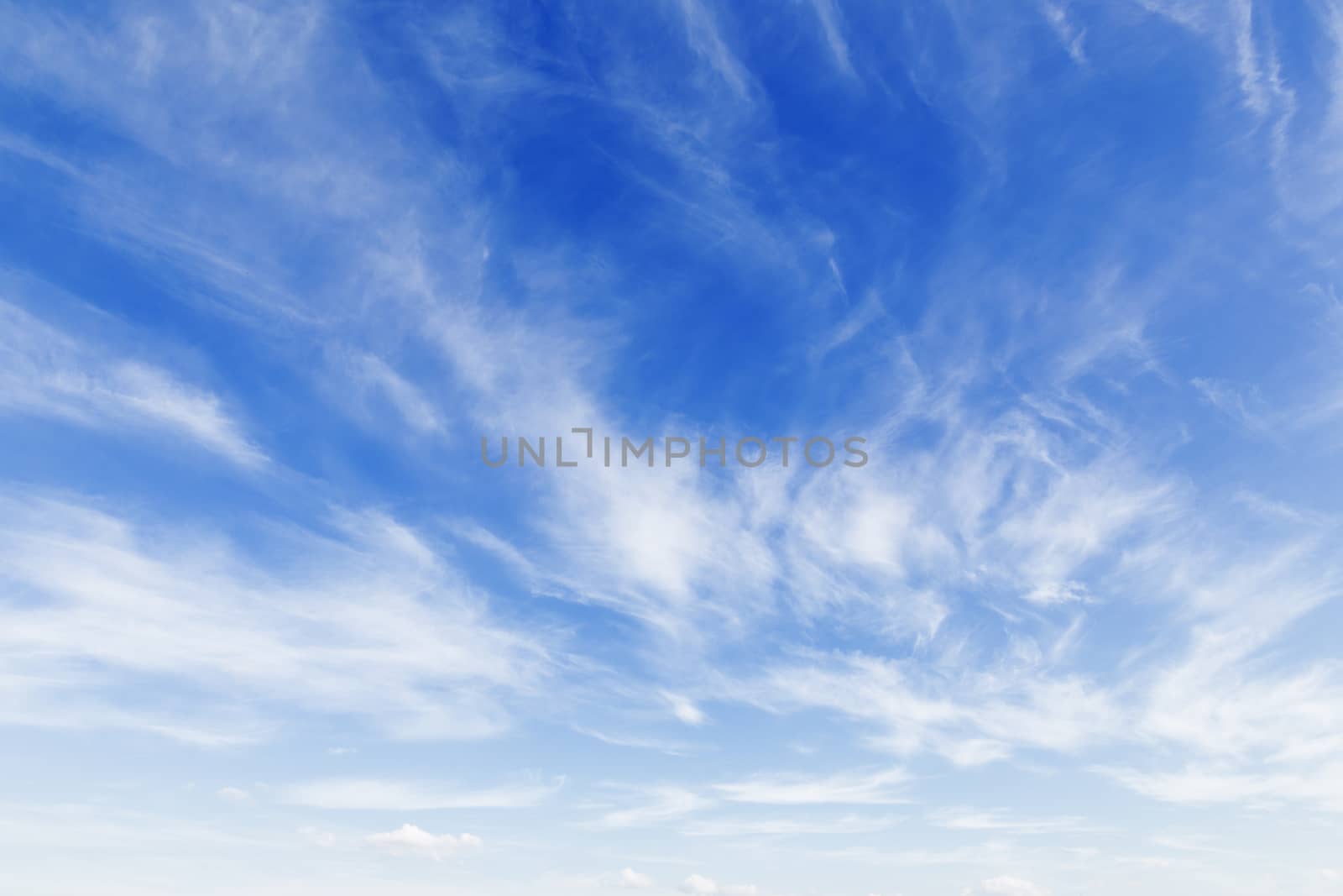 Bright sunny day with clouds. Cloudscape on blue sky. Soft focus.