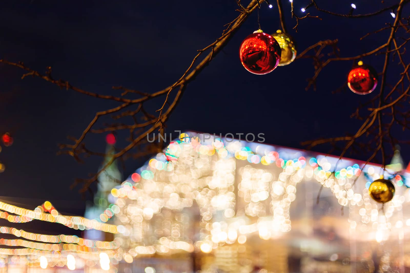 Streets of Moscow decorated for New Year and Christmas celebration. Tree with bright red and yellow balls. Russia.