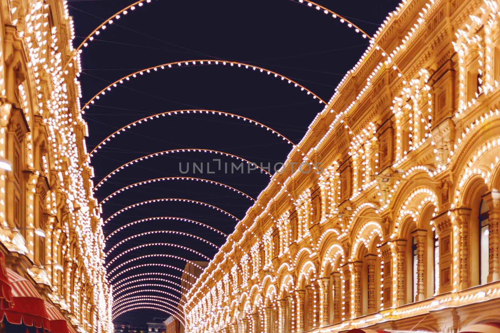 Vetoshny lane decorated with light bulbs for Christmas and New Year celebration. GUM (Main department Store). Russia.
