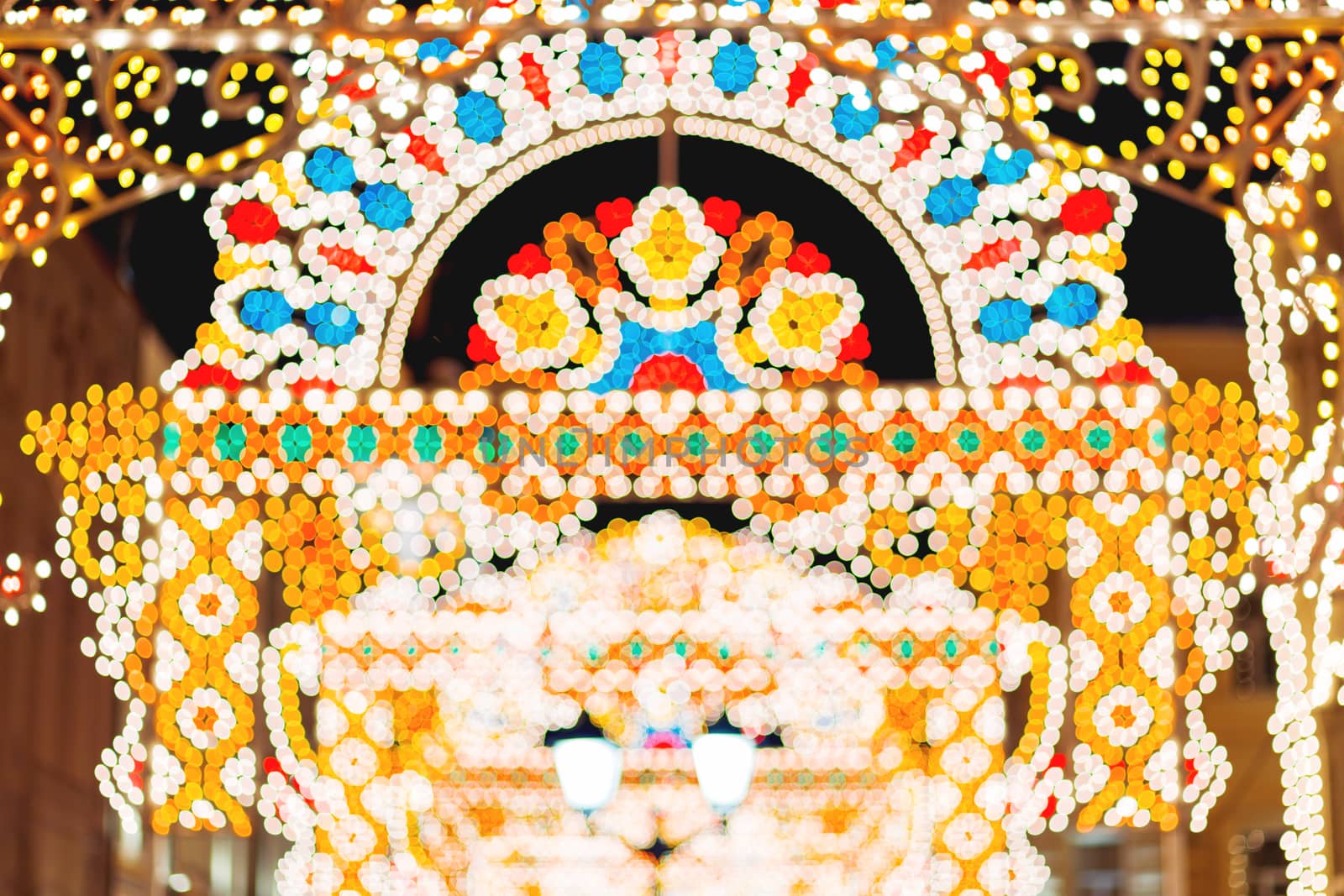 Streets of Moscow decorated for New Year and Christmas celebration. Buildings with light bulbs. Russia.