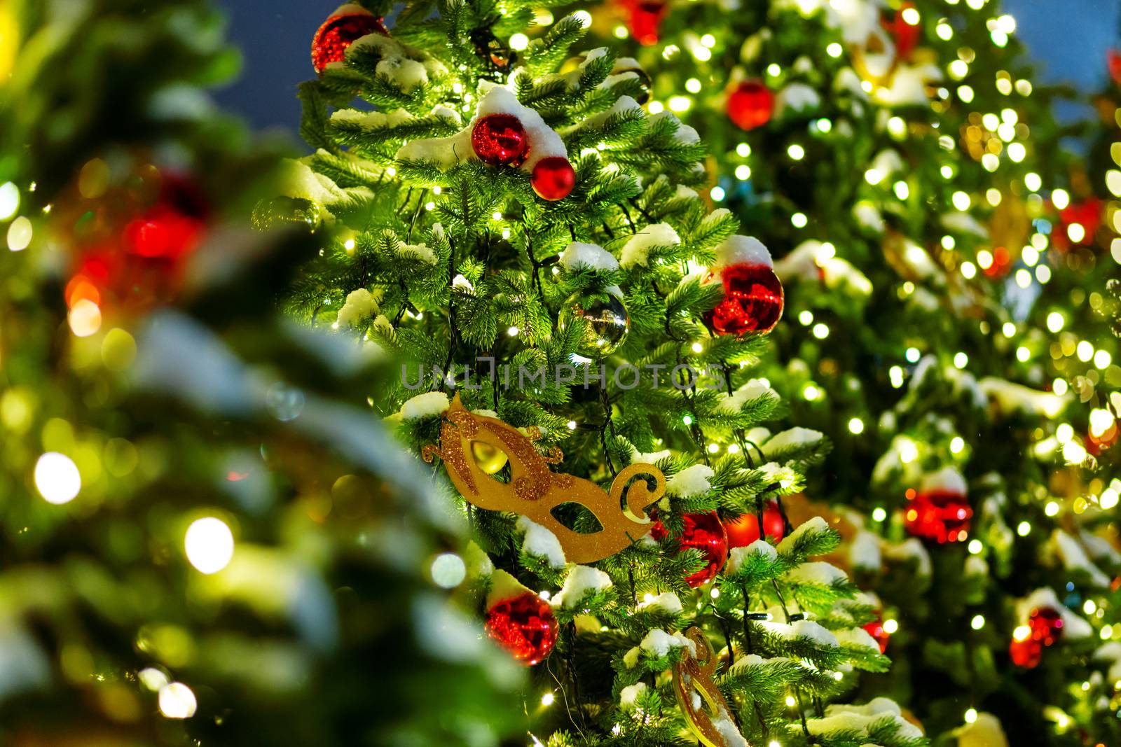 Outdoor decorations for New Year and Christmas celebration. Streets of Moscow decorated with light bulbs, theatre masks and colorful shiny balls. Russia.