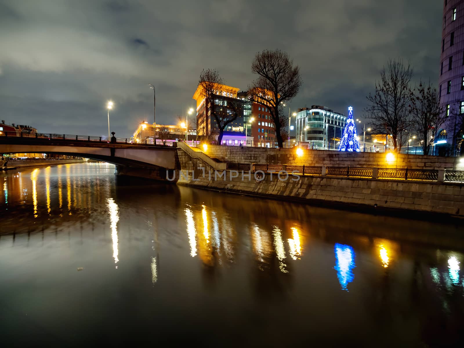 Gateway pedestrian bridge over Moscow-river. Night view on bridge between Kosmodamianskaya and Shluzovaya embankment. Moscow, Russia.