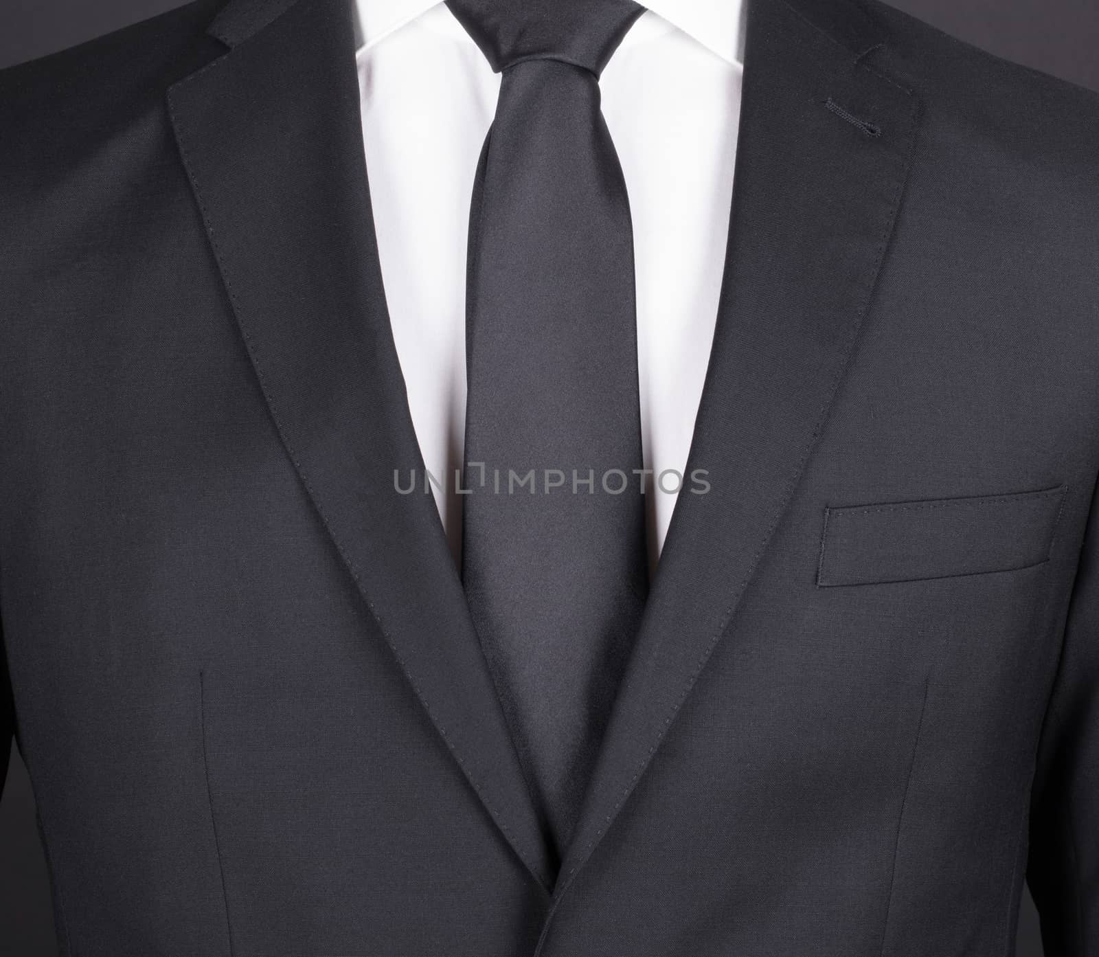 Man in a black suit, close-up by michaklootwijk