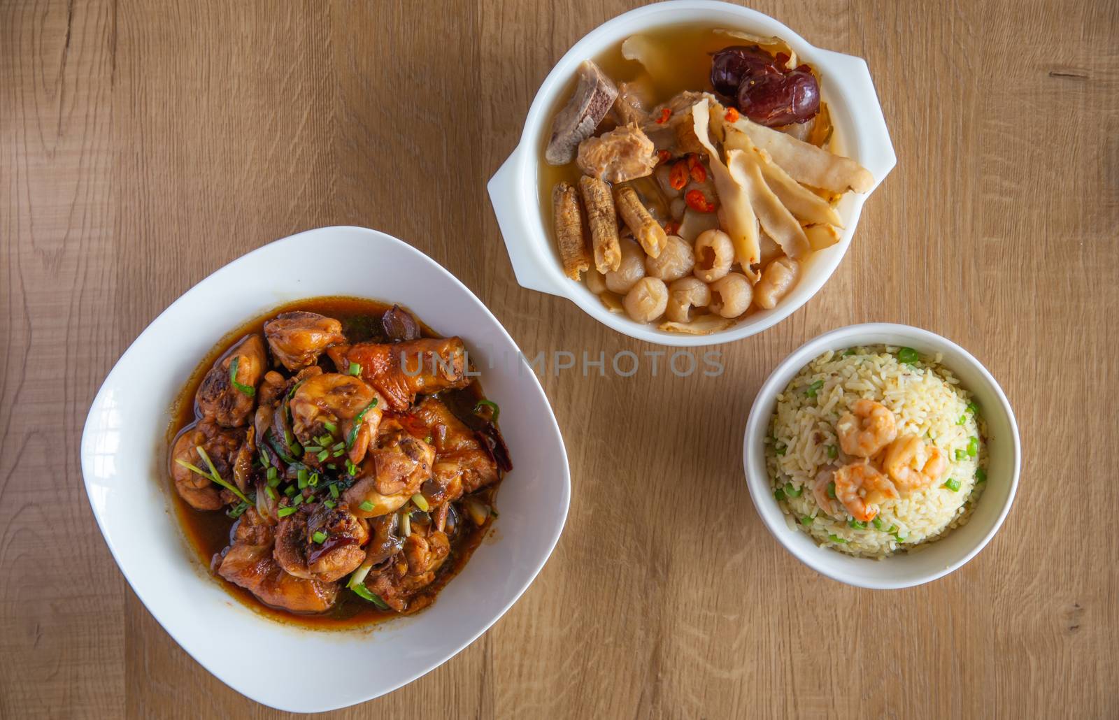 top view of various chinese food on wooden background