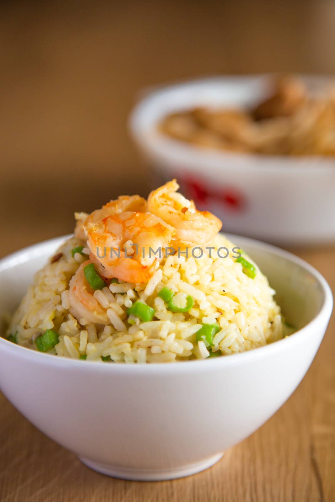 shrimp fried rice on wooden background
