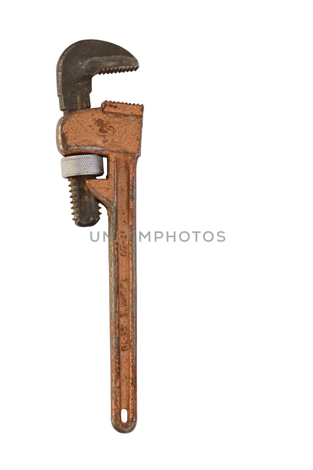 An old metal adjustable pipe wrench is positioned vertically and is isolated on a white background.
