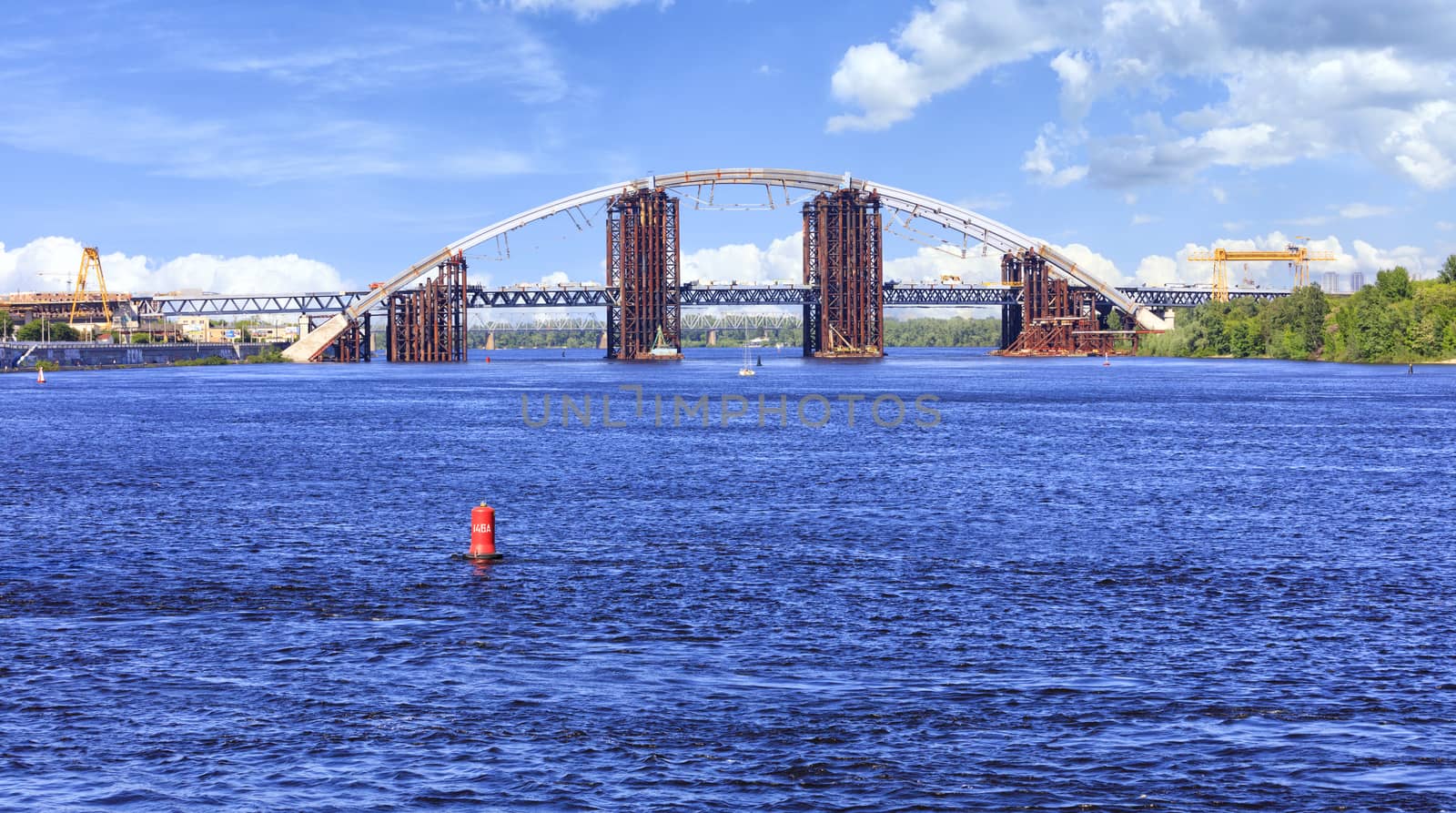 Construction Podolsky bridge on the Dnipro River in Kyiv. by Sergii