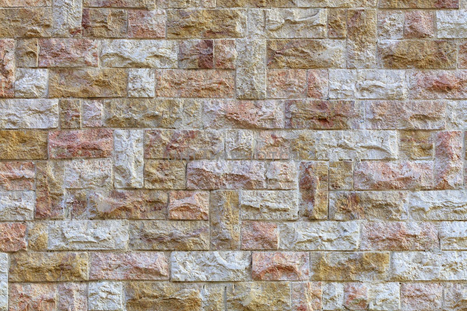 Wall mosaic made of red and beige sandstone tiles