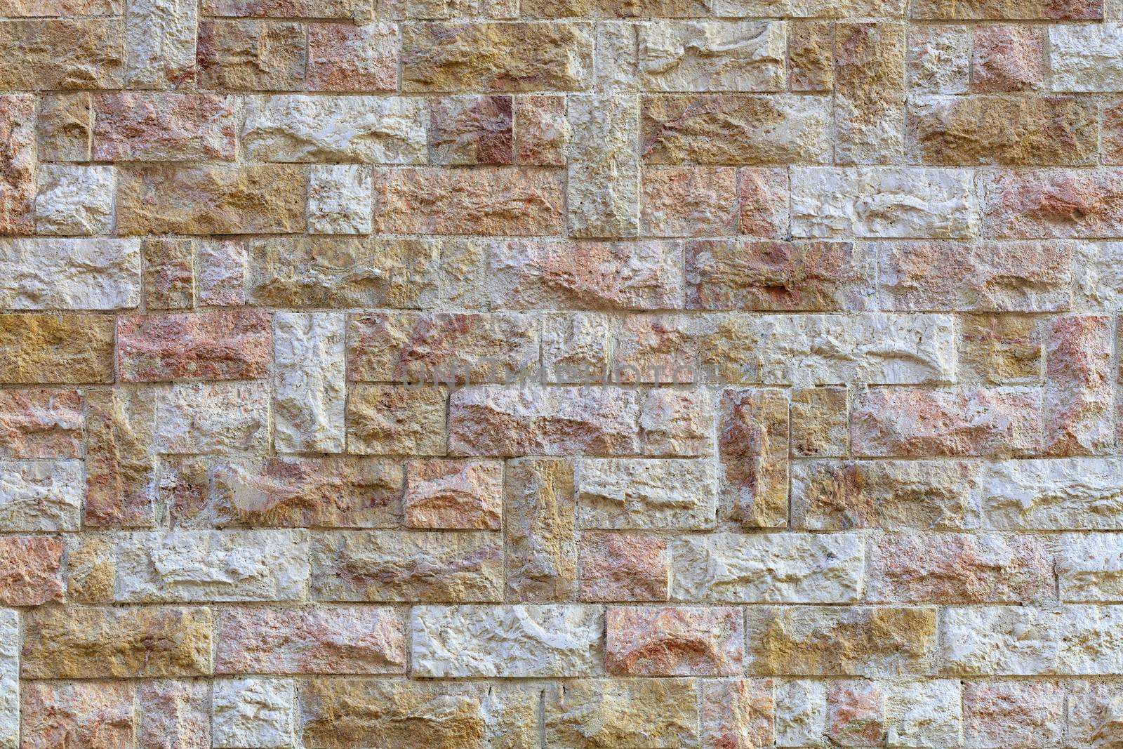 Wall mosaic made of red and beige sandstone tiles