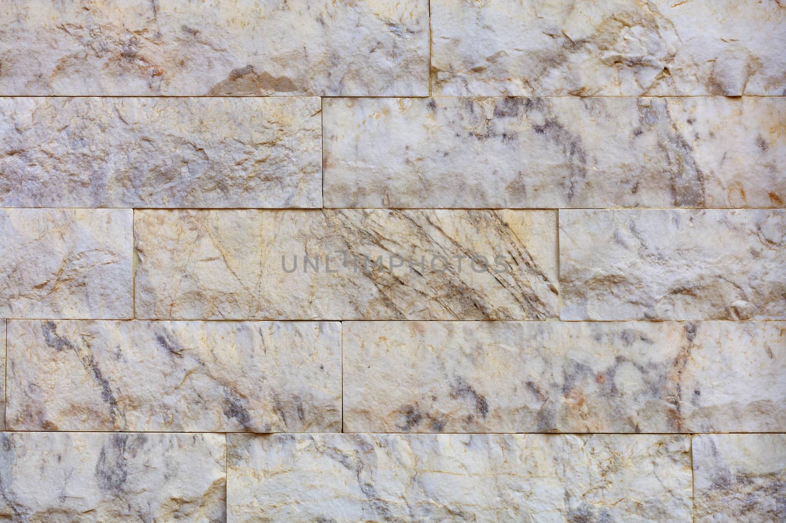 Closeup texture of marble tiles on the facade of the wall by Sergii