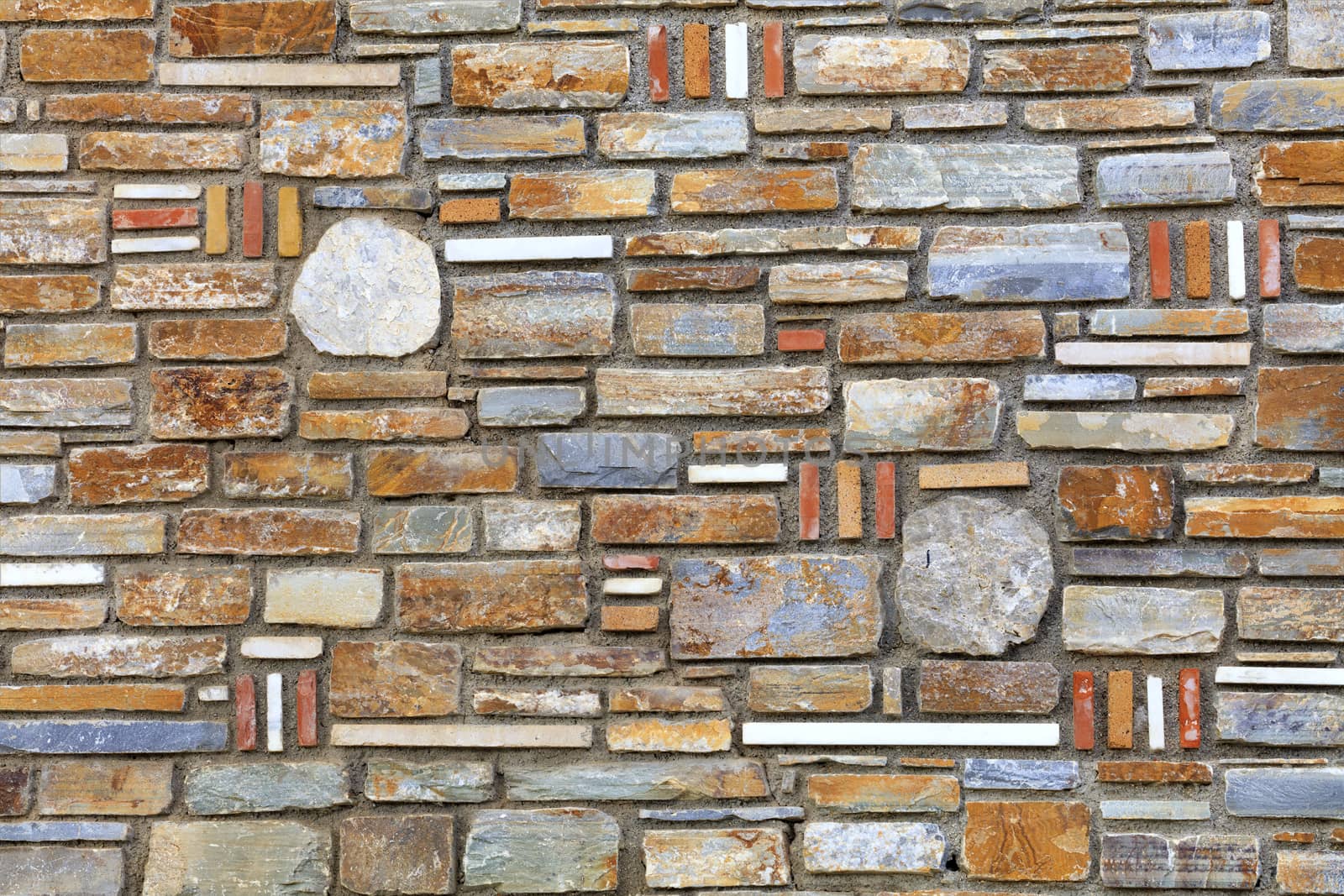 Wall mosaic from the texture of multi-colored sandstone