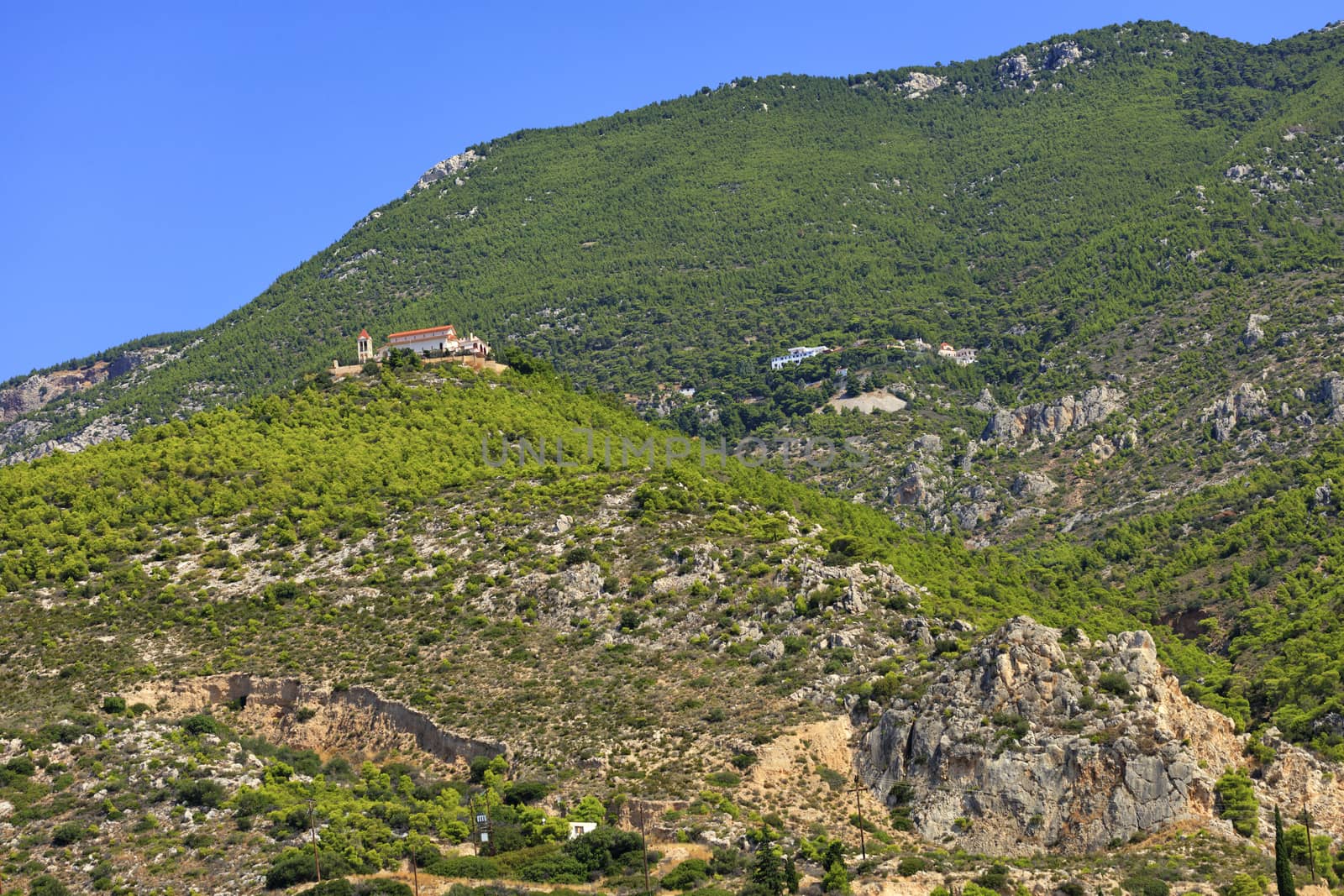 A bottom-up view of two monasteries, one male and one female, in Loutraki, Greece. by Sergii