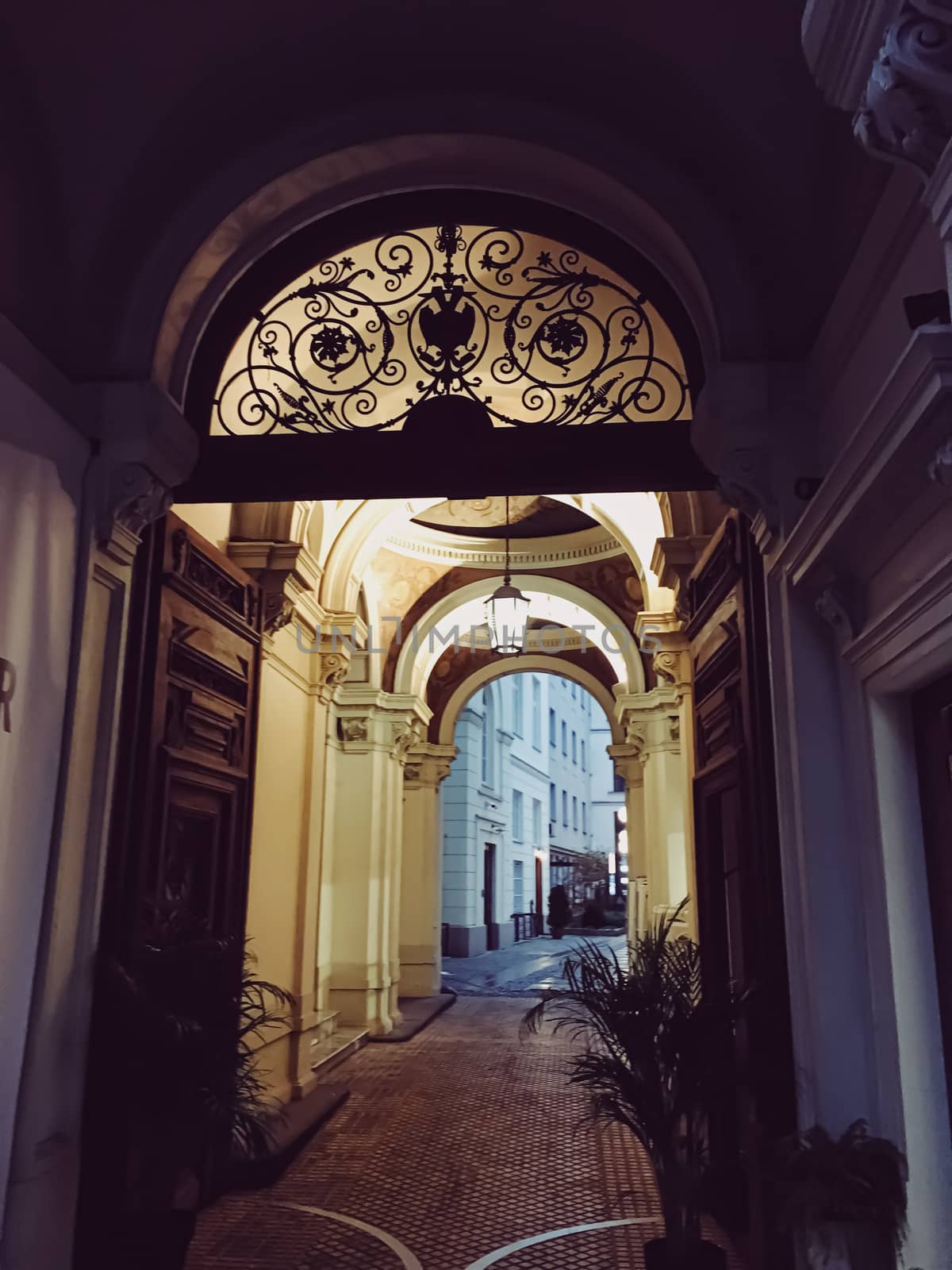 Exterior facade of classic building in the European city at night, architecture and design by Anneleven