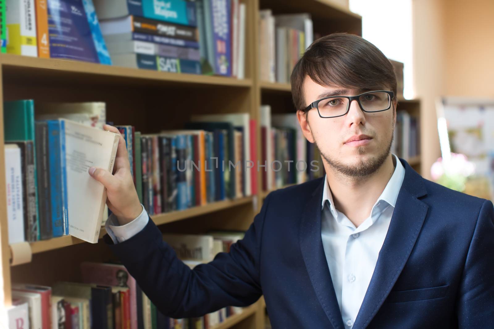 Belarus, Gomel, September 19, 2017. The main library. The day of open doors. An intimate man with glasses in the library. Student in the library