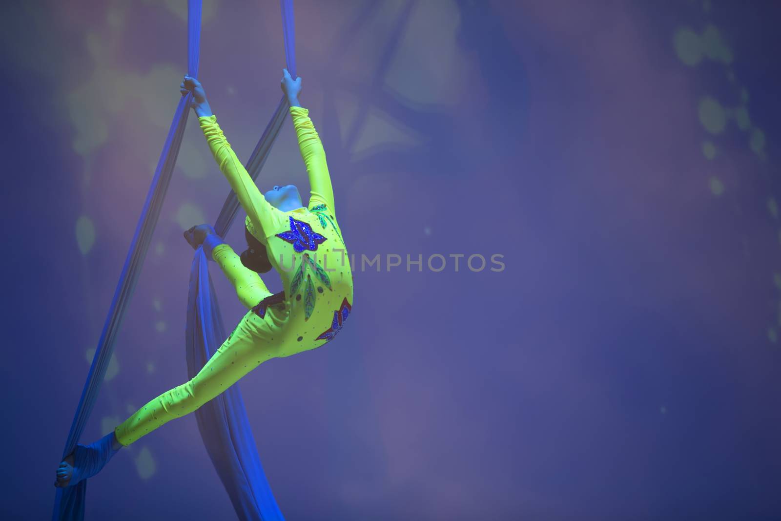 Belarus, Gomel, June 13, 2017 Palace of Culture, performance of the Abel Folk Circus,A girl dancing a dance on canvases.Children's sports. Girl gymnast. Straight tricks