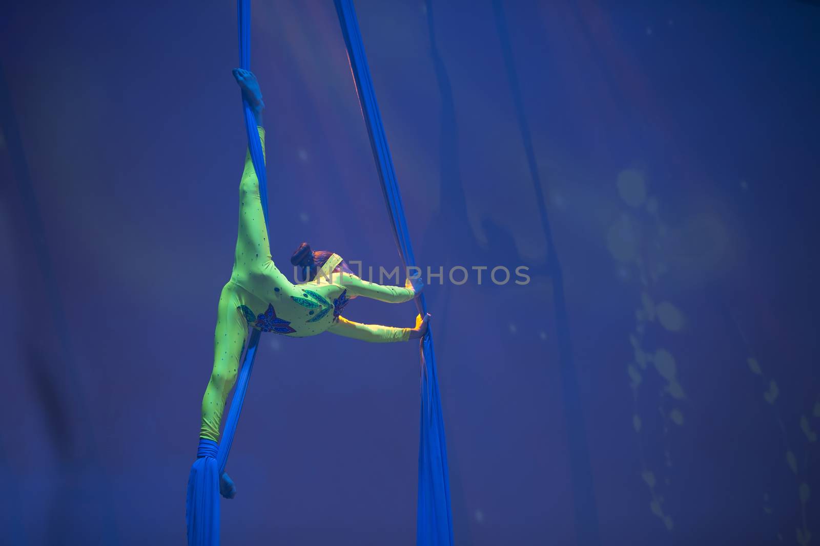 Belarus, Gomel, June 13, 2017 Palace of Culture, performance of the Abel Folk Circus,A girl dancing a dance on canvases.Children's sports. Girl gymnast. Straight tricks