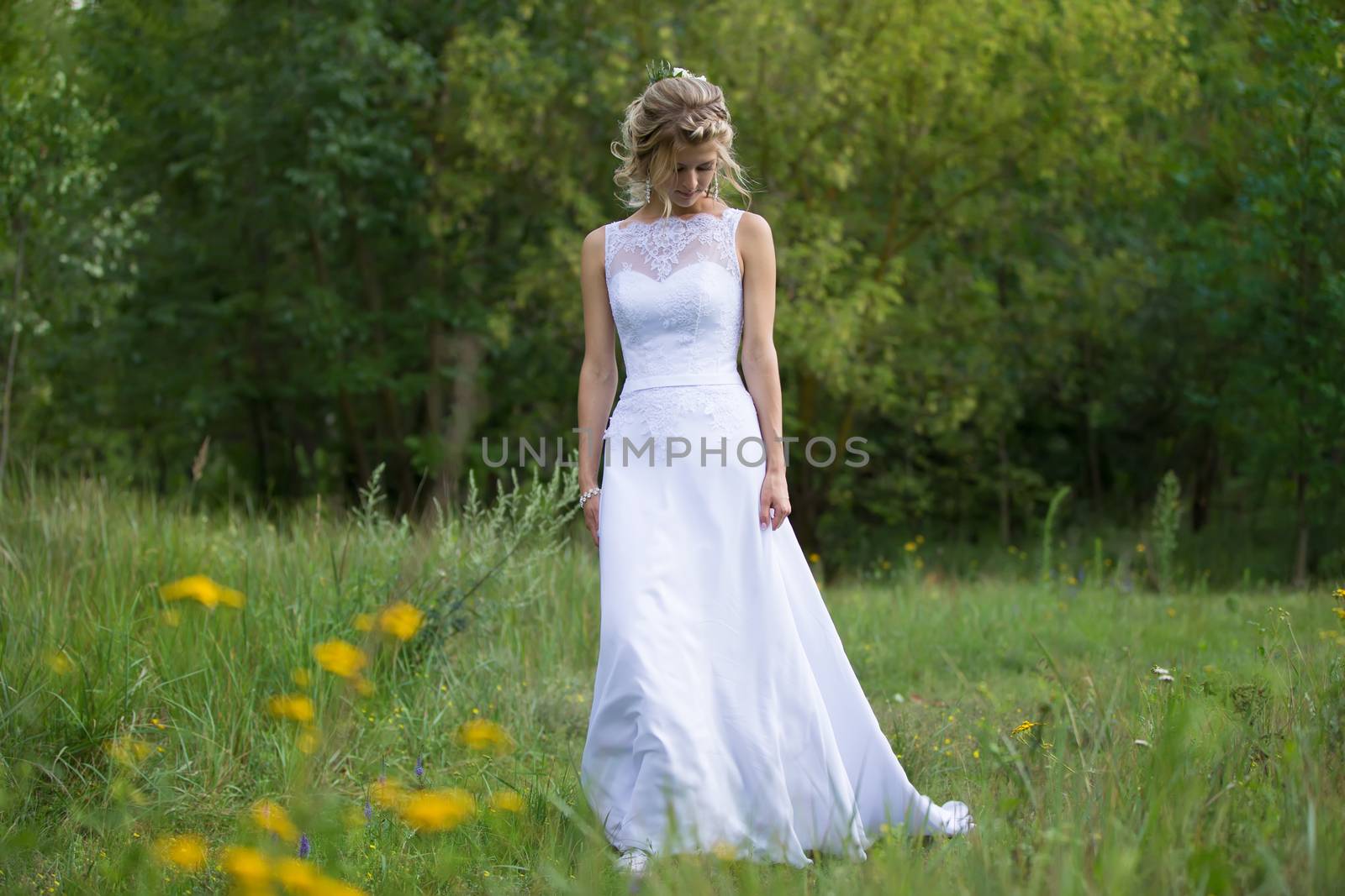 Wedding day.Bride in the forest walking along the road.Wedding day. The bride before the wedding. Beautiful bride.
