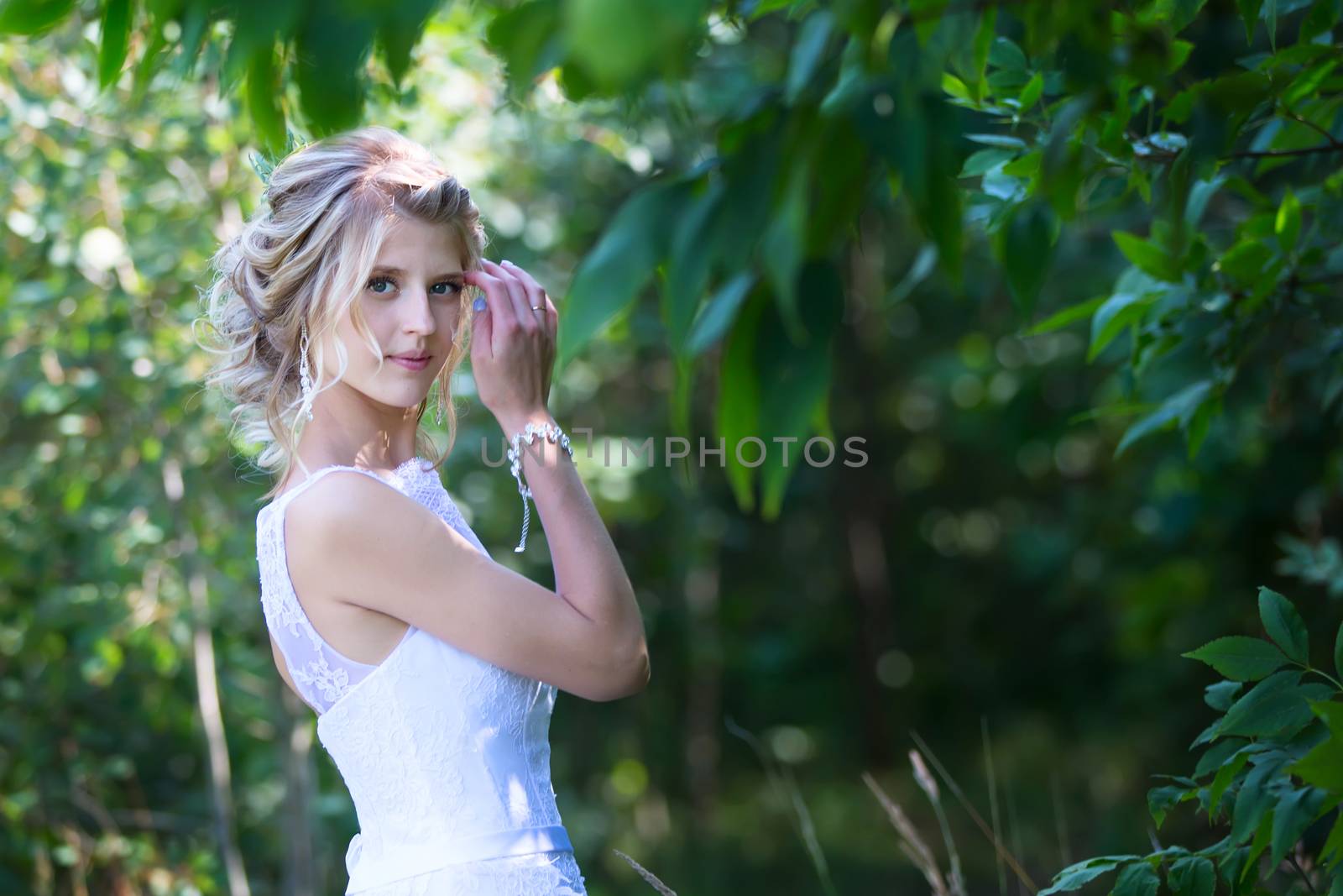 Portrait of the bride in the forest.Wedding day. The bride before the wedding. Beautiful bride.