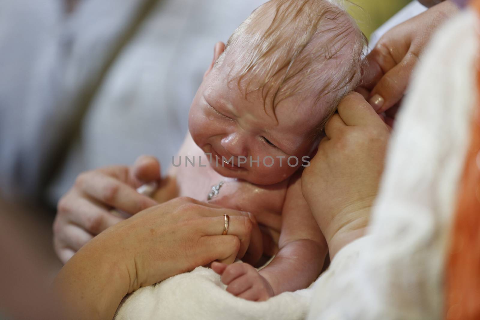 Belarus, the city of Gomel, St. Nicholas Monastery.Baptism of the Child.June 18, 2016.The infant is wearing a cross.Baptism of the baby. Acceptance of faith