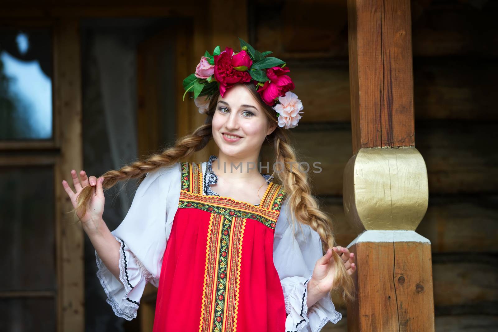 Beautiful woman portrait in russian style. Beautiful Russian girl in traditional dress. Russian style.