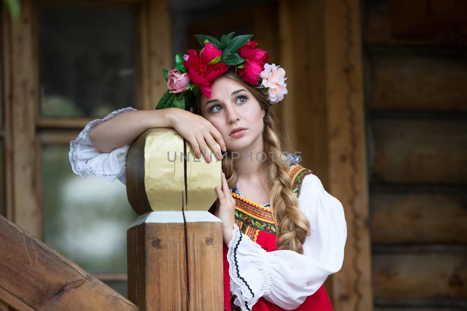 Russian beauty, emotional girl in traditional folk Russian costume and headdress adorable smiling and laughing