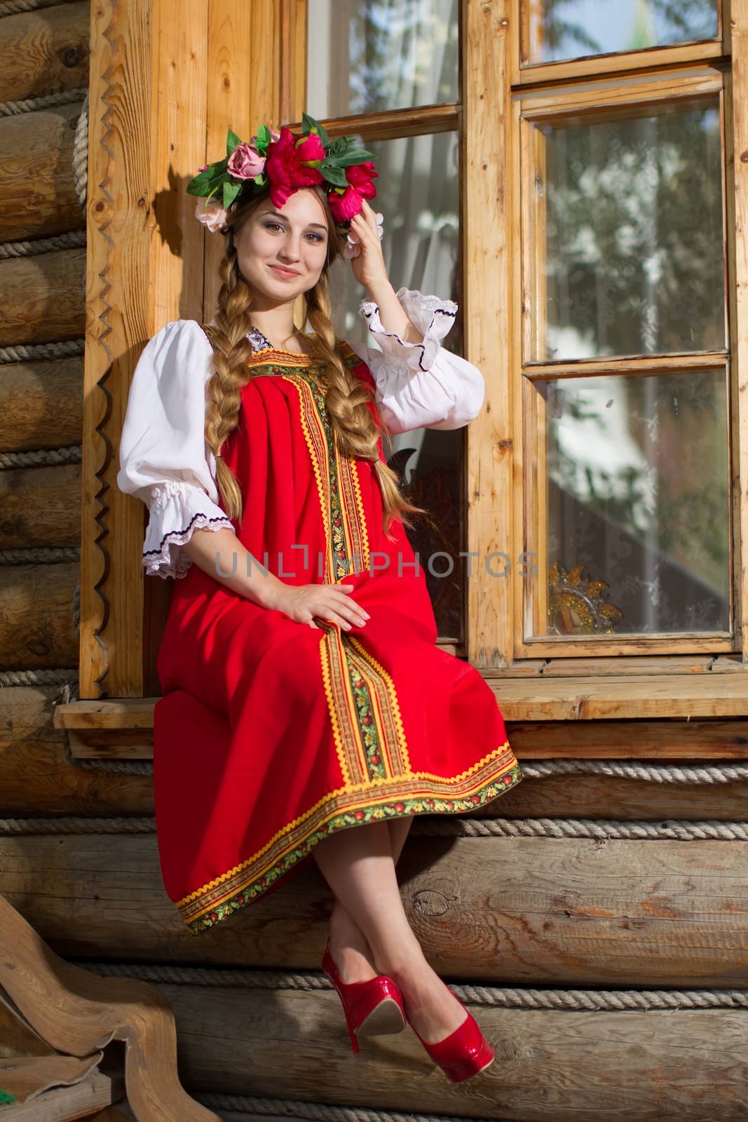 Beautiful woman portrait in russian style. Beautiful Russian girl in traditional dress. Russian style.