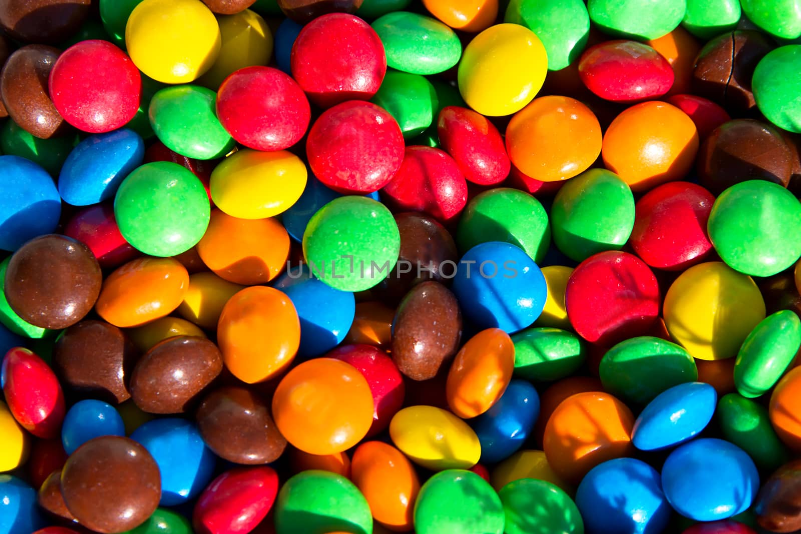 Panorama of small colorful jelly candies. Multicolored jelly